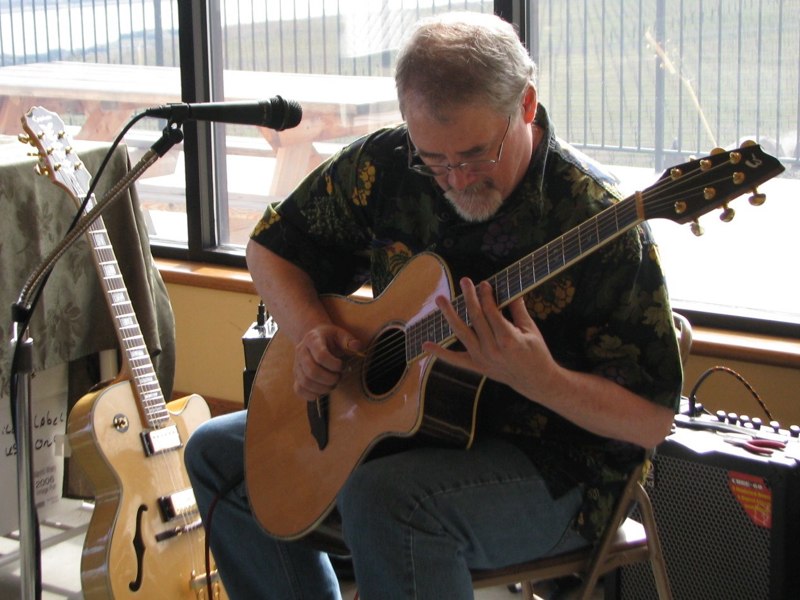More Jessica on the Breedlove while the Epiphone looks on... so jealous! ;-}